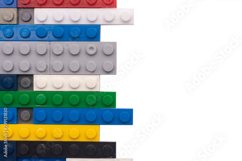 Multicolored plastic blocks of a children's designer isolated on white backgr...