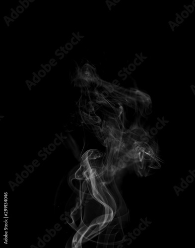 Movement of white smoke isolated on black background.Abstract shape and curve of smoke.