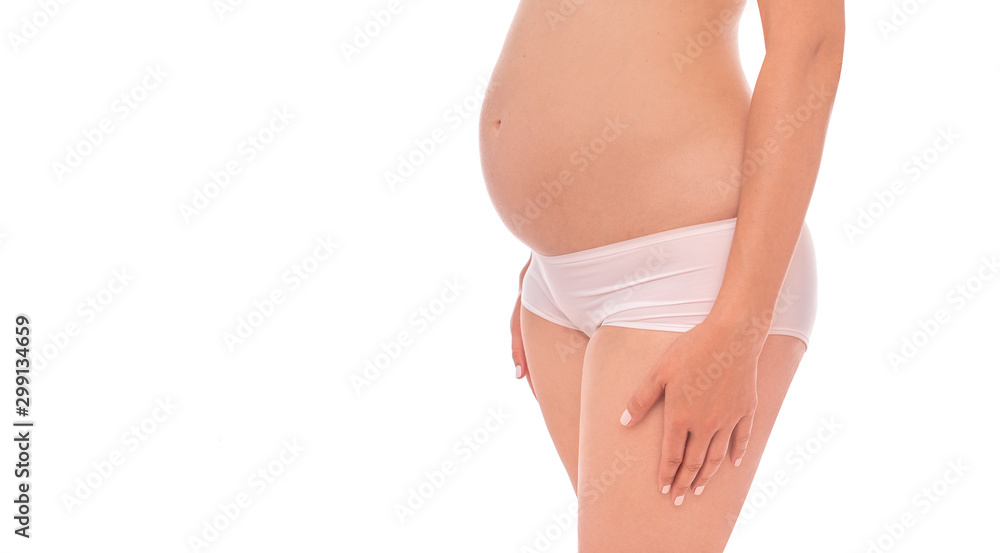 The body of a pregnant young woman on a white background.