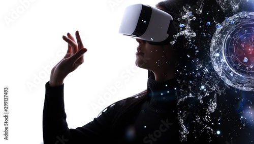 Double exposure of female face. Abstract woman portrait. Digital art. Beautiful female in VR helmet scrolling invisible screen while interacting with virtual reality under neon light.