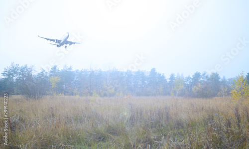 The plane over the forest and dry air. Travel, tourism.