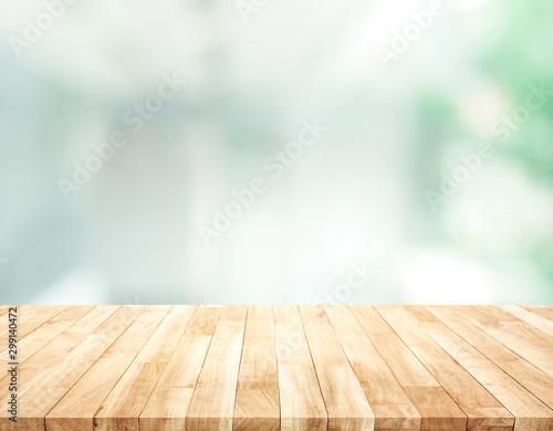 Empty wood table top on blur abstract modern room