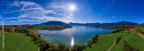 Fantastic panoramic view over the bavarian lake Tegernsee in autumn with fall colors, made by a drone.