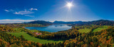 Fantastic panoramic view over the bavarian lake Tegernsee in autumn with fall colors, made by a drone.
