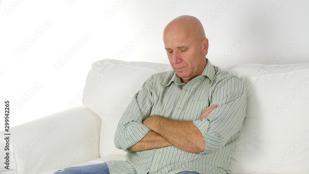 Image with a Tired Person Sleeping on the Sofa in Living Room