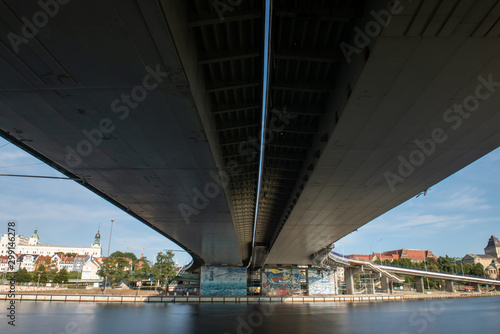 Left bank of the Oder river in Szczecin with the maritime museum and the Chrobry embankment, Szczecin, Poland. View under the bridge photo