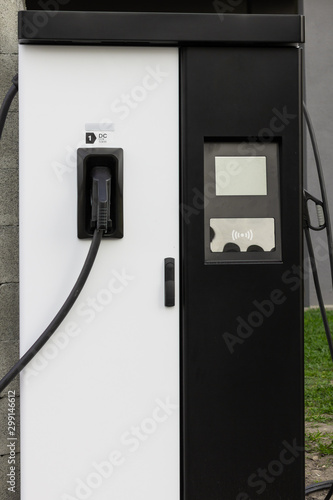 Modern electrical fast charger to hybrid automobiles. High technology charger for green way of driving PHEV. Ecology friendly charger. New generation of environmental friendly green petrol station.