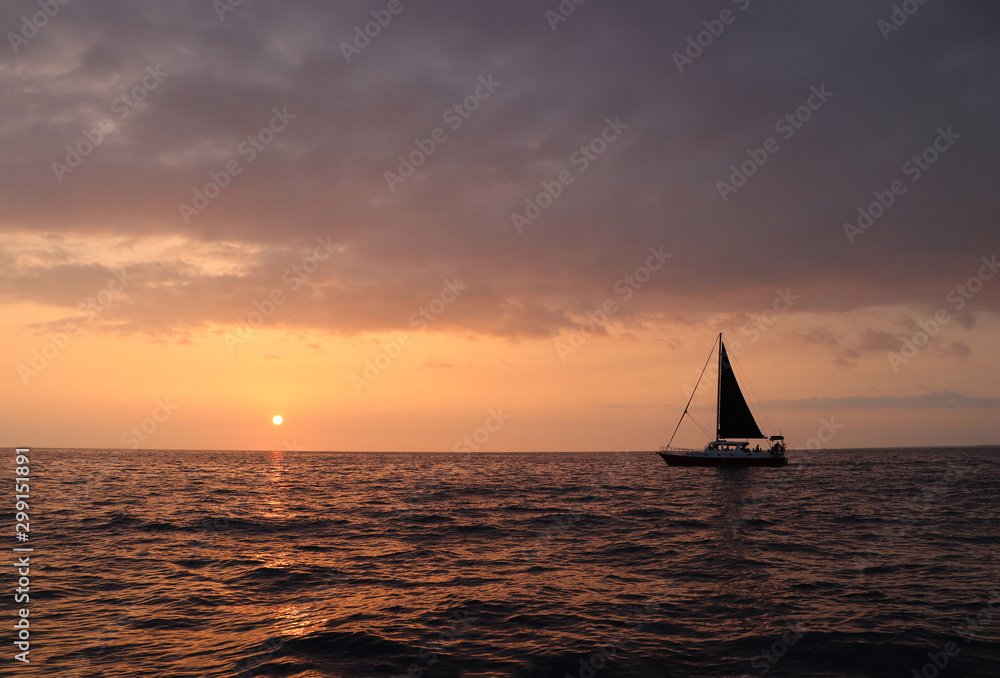 Sailing ship at sunset on the sea