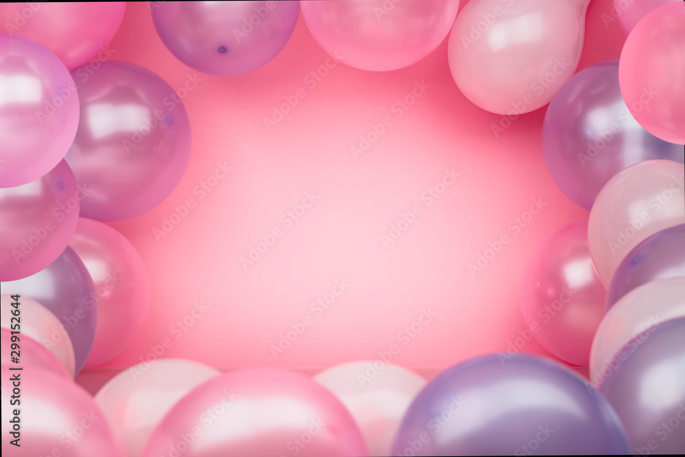 Pink background with pink and purple balloons. Bright background for celebration. Pink background with pink and purple balloons. Bright background for celebration.