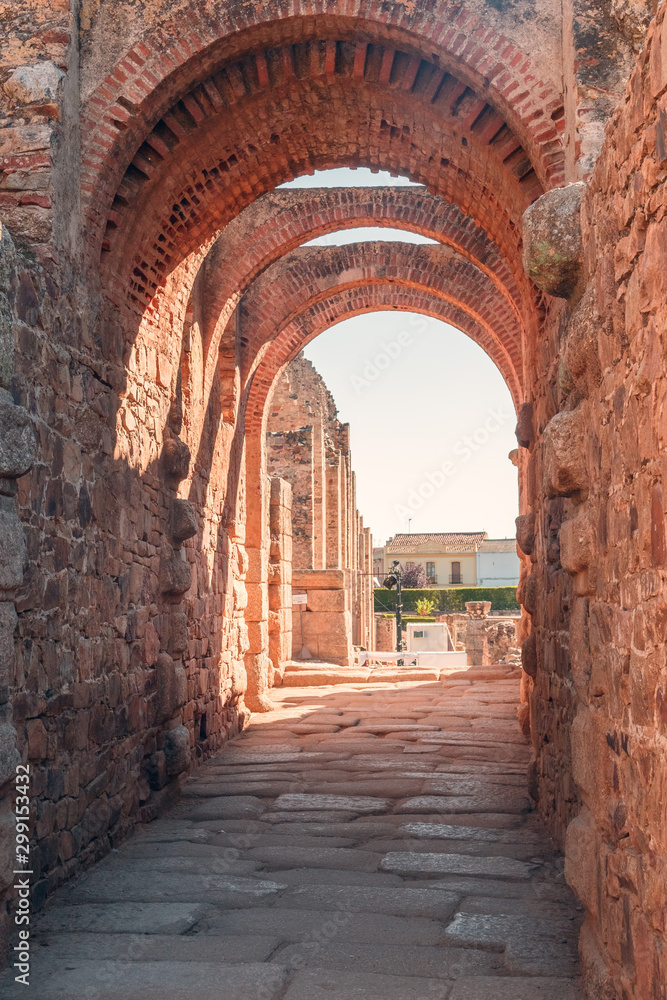 MERIDA, EXTREMADURA, SPAIN - AUGUST 08, 2019: Roman Theatre and Amphitheatre. Tourists in the architectural and monumental complex of the ancient and picturesque streets of Merida
