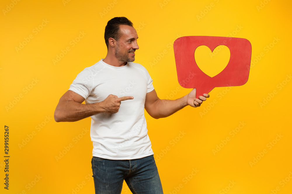 Man is happy because receives hearts on social network Man is happy because receives hearts on social network