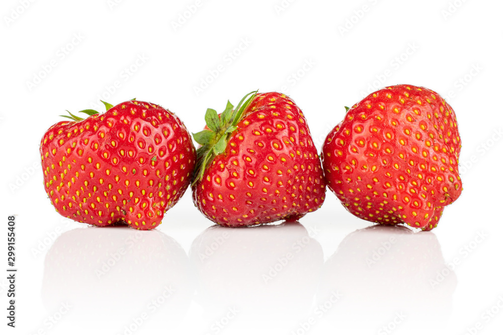 Group of three whole fresh red strawberry in row isolated on white background Group of three whole fresh red strawberry in row isolated on white background