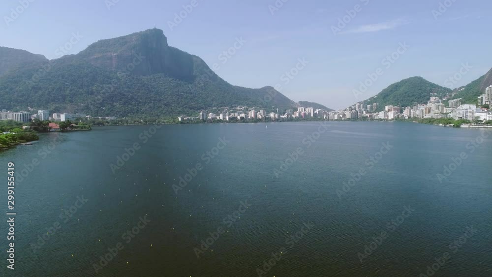 Aerial view of seawater lake Rodrigo de Freitas Lagoon (Lagoa) in city of Rio de Janeiro. You can see the statue of Christ the Redeemer in the background. 4K. Aerial view of seawater lake Rodrigo de Freitas Lagoon (Lagoa) in city of Rio de Janeiro. You can see the statue of Christ the Redeemer in the background. 4K.
