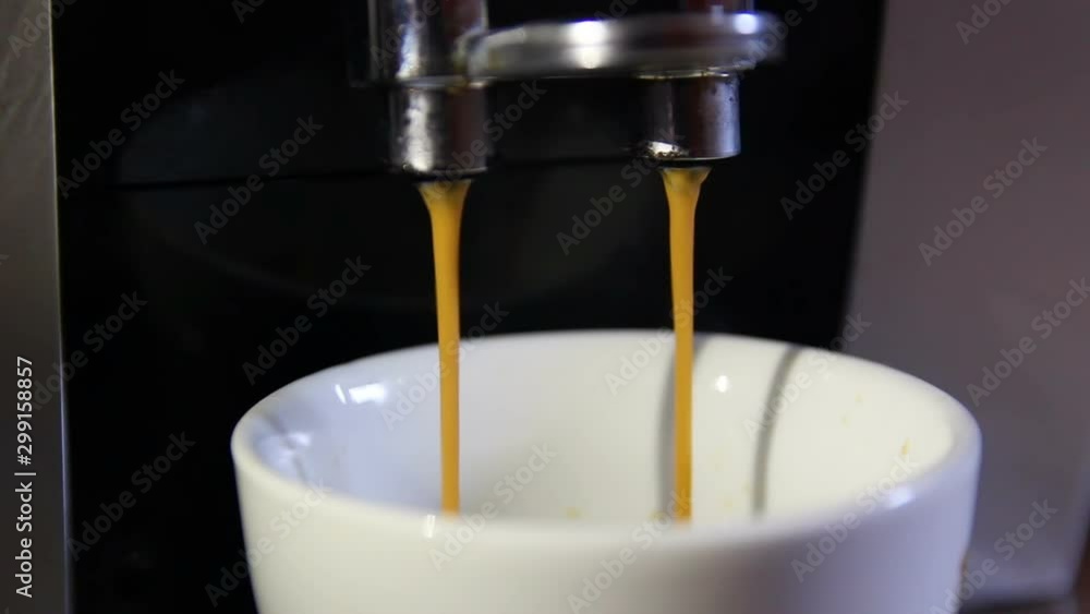 Close up of makeing cup of coffee in coffee maker Close up of makeing cup of coffee in coffee maker