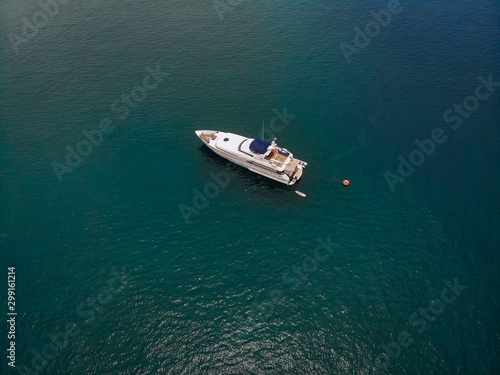 Top view of the luxurious yacht in the vast blue sea; lifestyle concept.