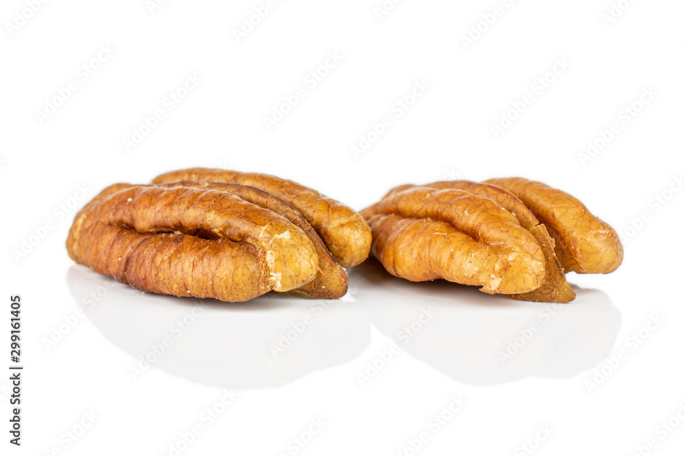 Group of two whole dry brown pecan nut isolated on white background