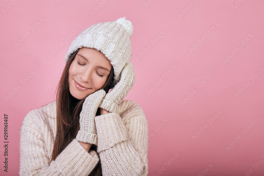 Cute girl sleeping on her hands in mittens