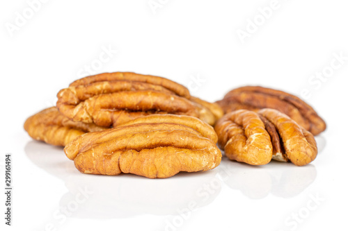 Group of five whole dry brown pecan nut isolated on white background