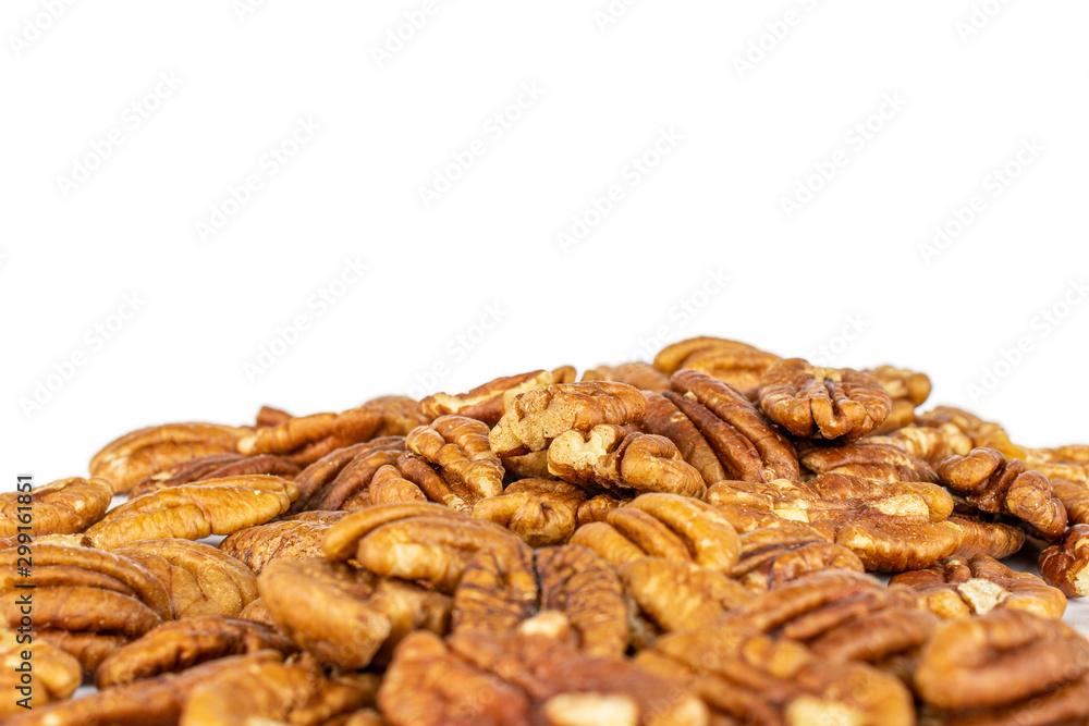 Fototapeta premium Lot of whole dry brown pecan nut isolated on white background