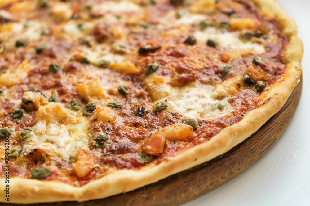 Italian pizza with seafood on white background Italian pizza with seafood on white background