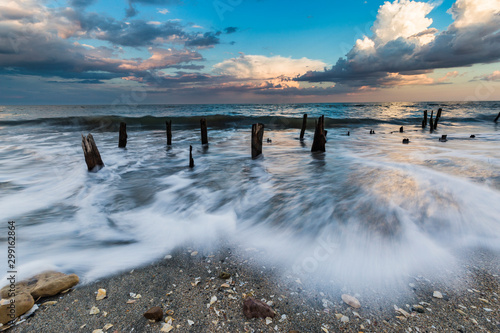 Wood pillars at the Black Sea © Alex