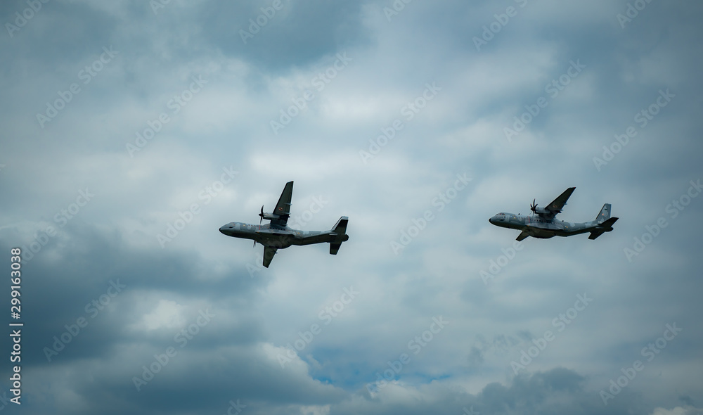 KRAKOW / POLAND - JUNE 23, 2019: low-altitute of two military planes CASA-C295M during Air Picnic Krakow, Poland. KRAKOW / POLAND - JUNE 23, 2019: low-altitute of two military planes CASA-C295M during Air Picnic Krakow, Poland.