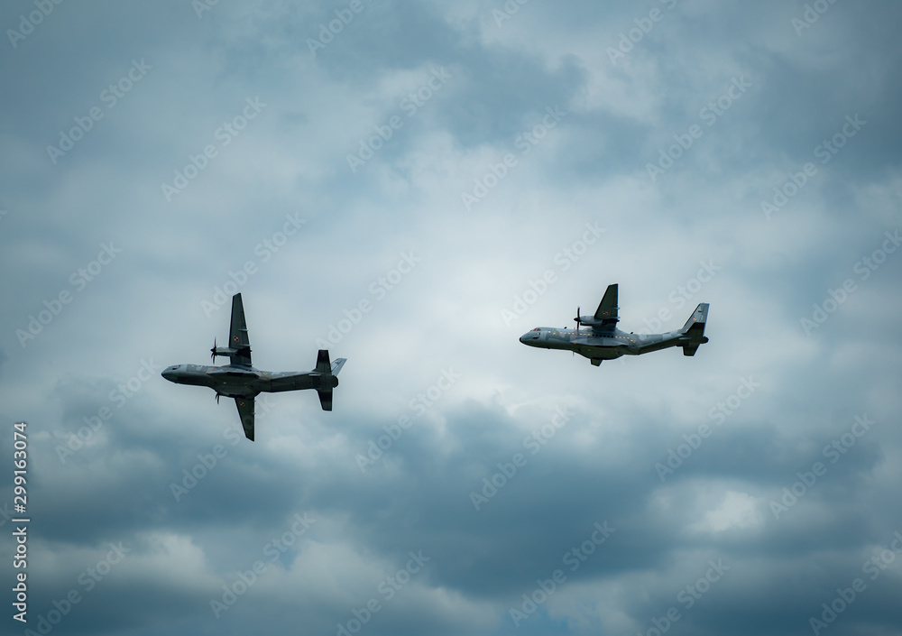 KRAKOW / POLAND - JUNE 23, 2019: low-altitute of two military planes CASA-C295M during Air Picnic Krakow, Poland. KRAKOW / POLAND - JUNE 23, 2019: low-altitute of two military planes CASA-C295M during Air Picnic Krakow, Poland.