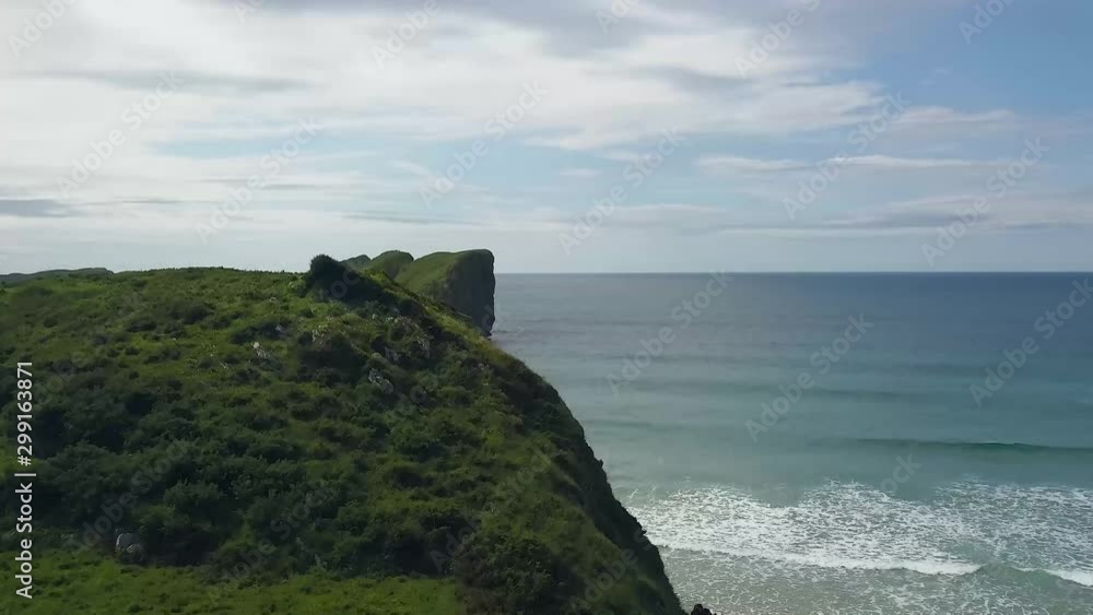 4K aerial drone shot of the ocean behind a cliff 4K aerial drone shot of the ocean behind a cliff