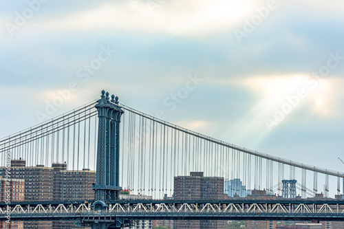 The Manhattan Bridge is a suspension bridge that crosses the East River in New York City, connecting Lower Manhattan with Downtown Brooklyn.