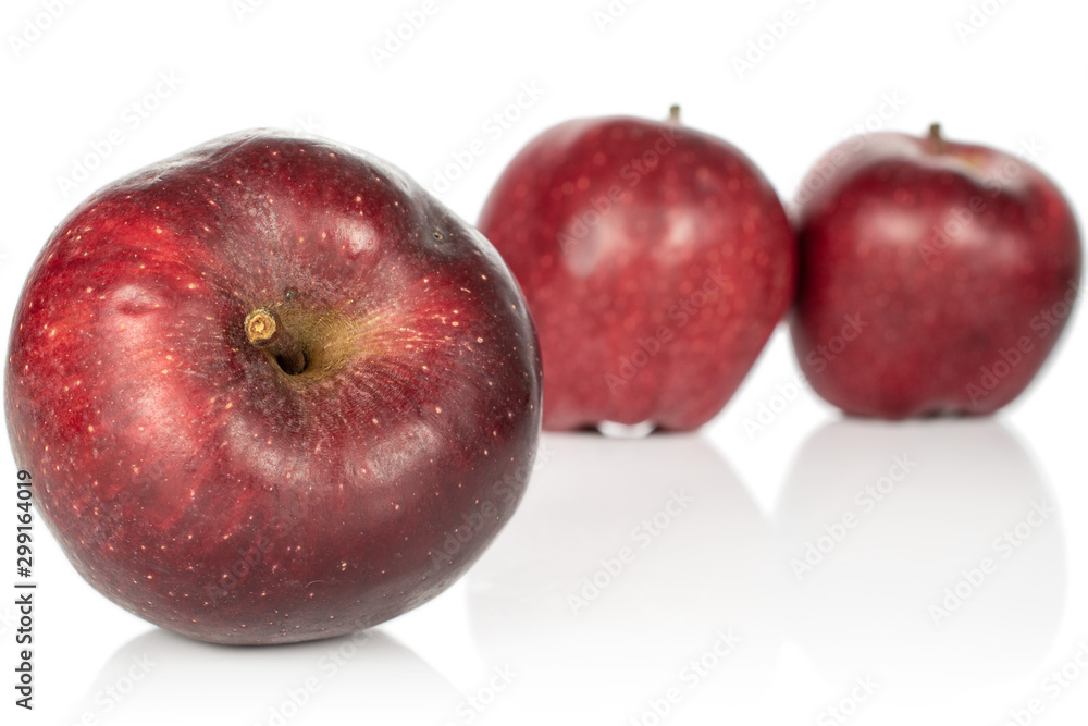 Group of three whole fresh apple red delicious isolated on white background