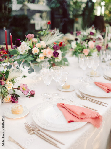 Table settings for a luxury wedding reception. Outdoor wedding