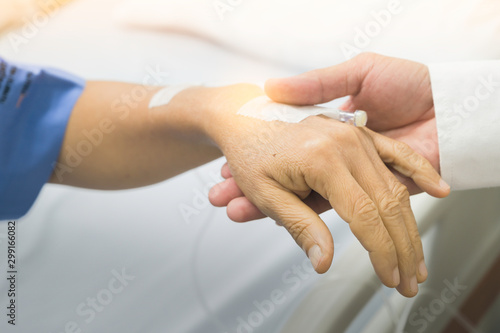 Holding hands Asian senior or elderly old lady woman patient with love, care, encourage and empathy at nursing hospital ward : healthy strong medical concept