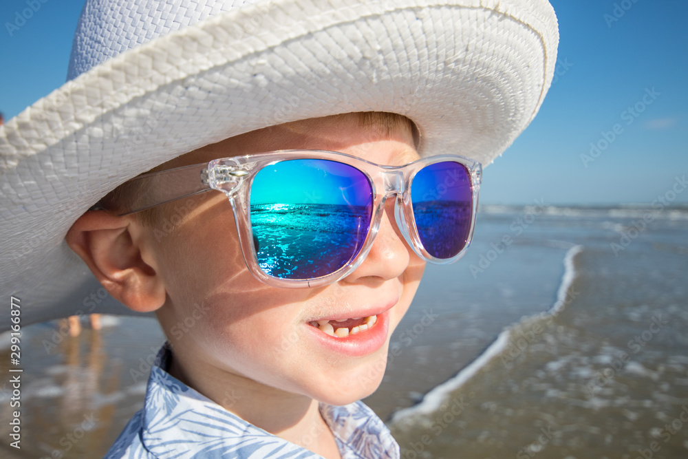 happy child with sunglasses look the sun on the beach happy child with sunglasses look the sun on the beach