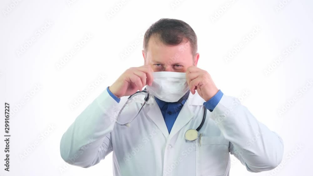 Nice chubby doctor with a beard in a white coat on a white isolated background Nice chubby doctor with a beard in a white coat on a white isolated background