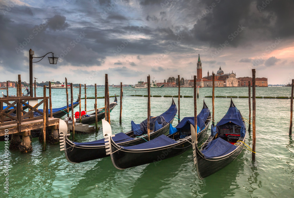 San Giorgio Maggiore Church with venetian boats at the harbor, Venice. Italy