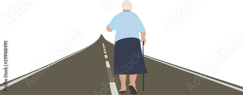 anziana di spalle cammina con il bastone sulla strada photo