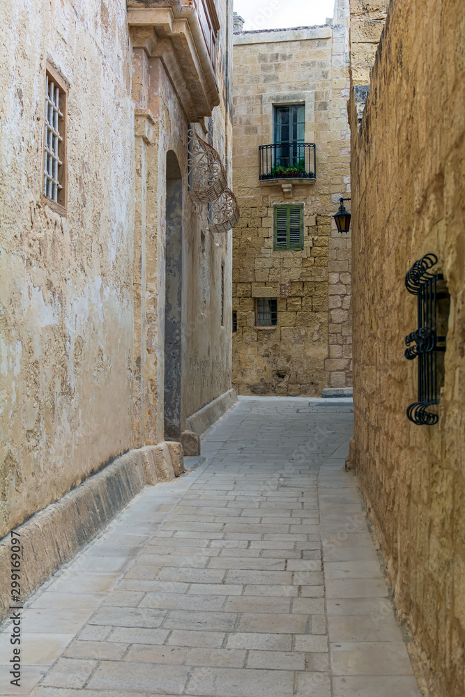 Typical Mdina street. Narrow medieval street of Mdina, also known as 