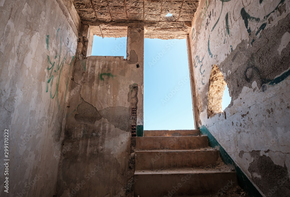 stairs and exit of run down room in abandoned building ruin - way out