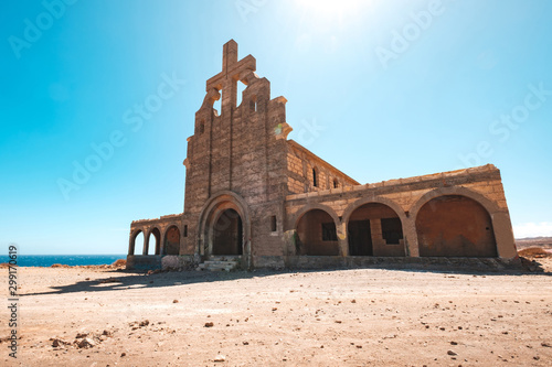  old church building ruin in desert landscape