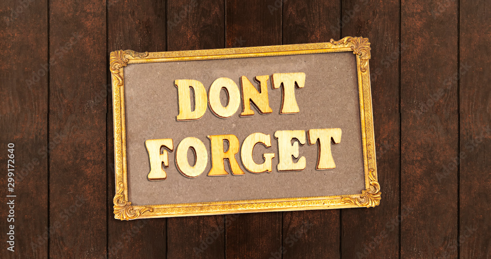 dont forget composed with wooden letters on frame photo on wood table dont forget composed with wooden letters on frame photo on wood table