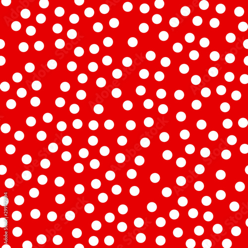 Random scattered polka dot pattern, abstract red and white background, white dots on red.