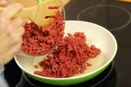 Adding ground beef into frying pan