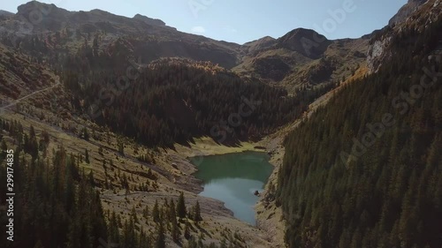 Aerial of the mountains and lakes around Spaneggsee and Talalpsee in Filzbach, Switzerland. Drone very slow forward dolly photo