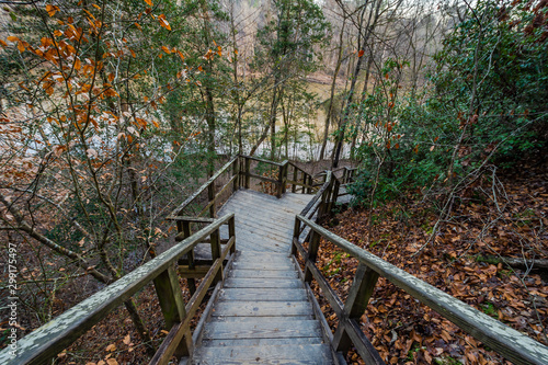 Trail path with wooden handrail in Raven Rock State Park, North Carolina, United States.