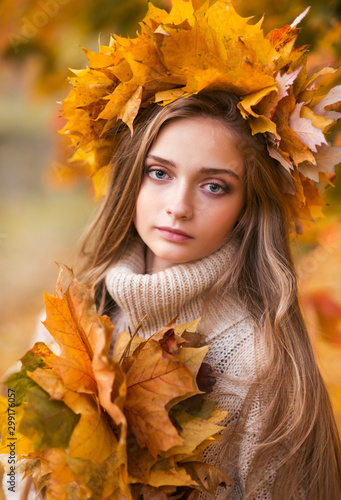 girl with autumn wreath of leaves