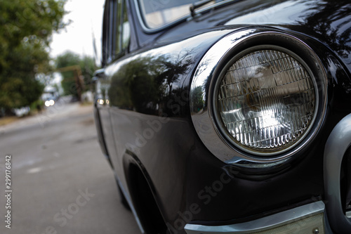 Old luxury car headlight close up © revol_deeps