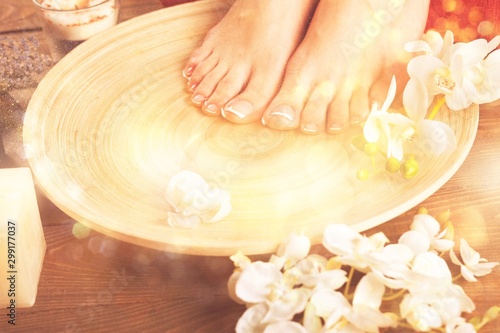 Spa and Wellness Setting with Female Feet on a Plate