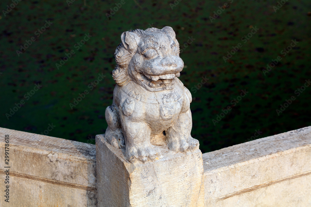 Ancient Chinese stone lion sculpture