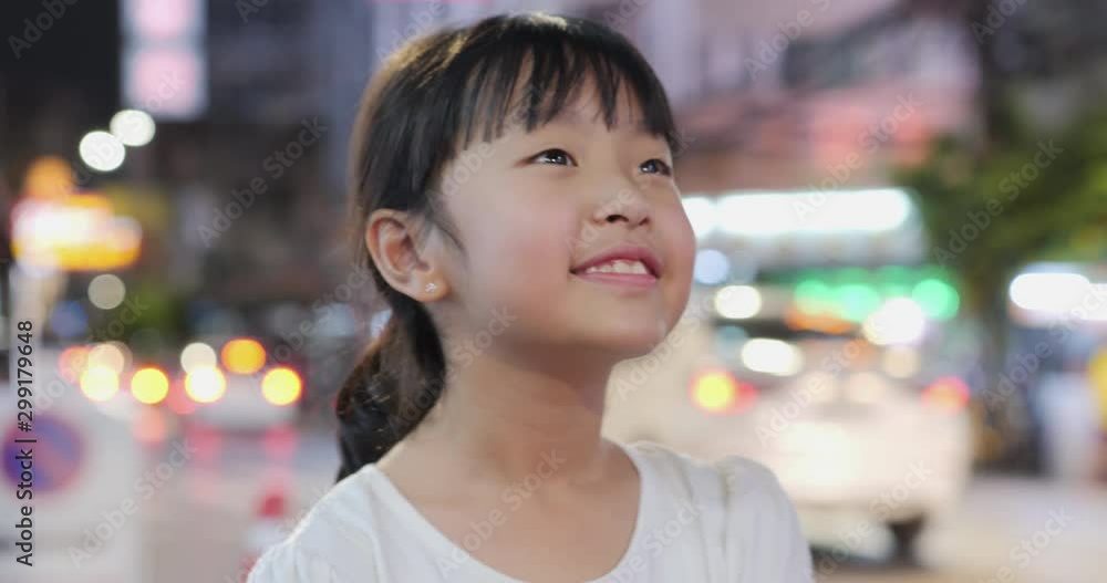 Portrait of little girl standing at the street and looking around city. Travel concept. Portrait of little girl standing at the street and looking around city. Travel concept.