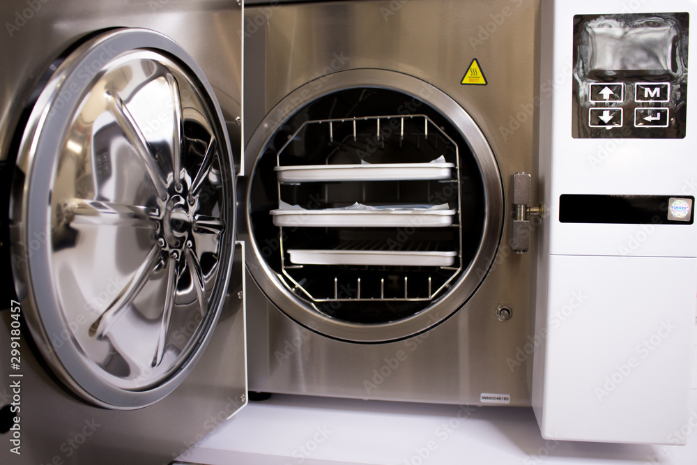 Sterilizing medical instruments in autoclave. Equipment for sterile cleaning of working medical instruments.